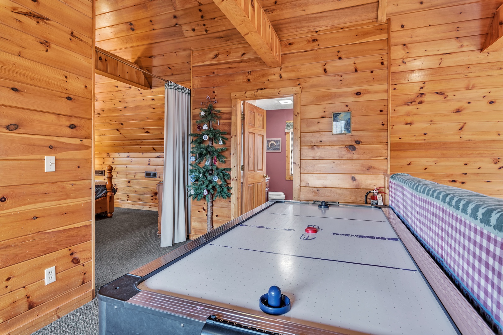 Elevate your stay with a game of air hockey in the loft