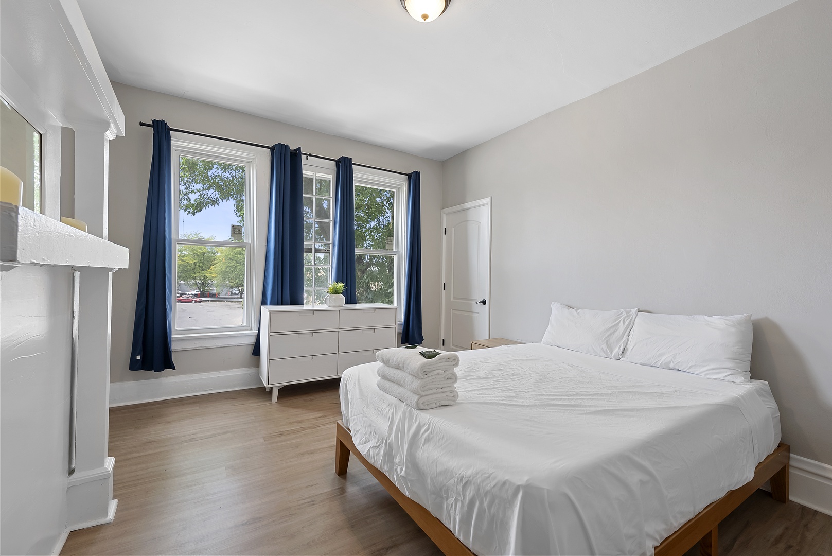 The second bedroom features a plush king-sized bed