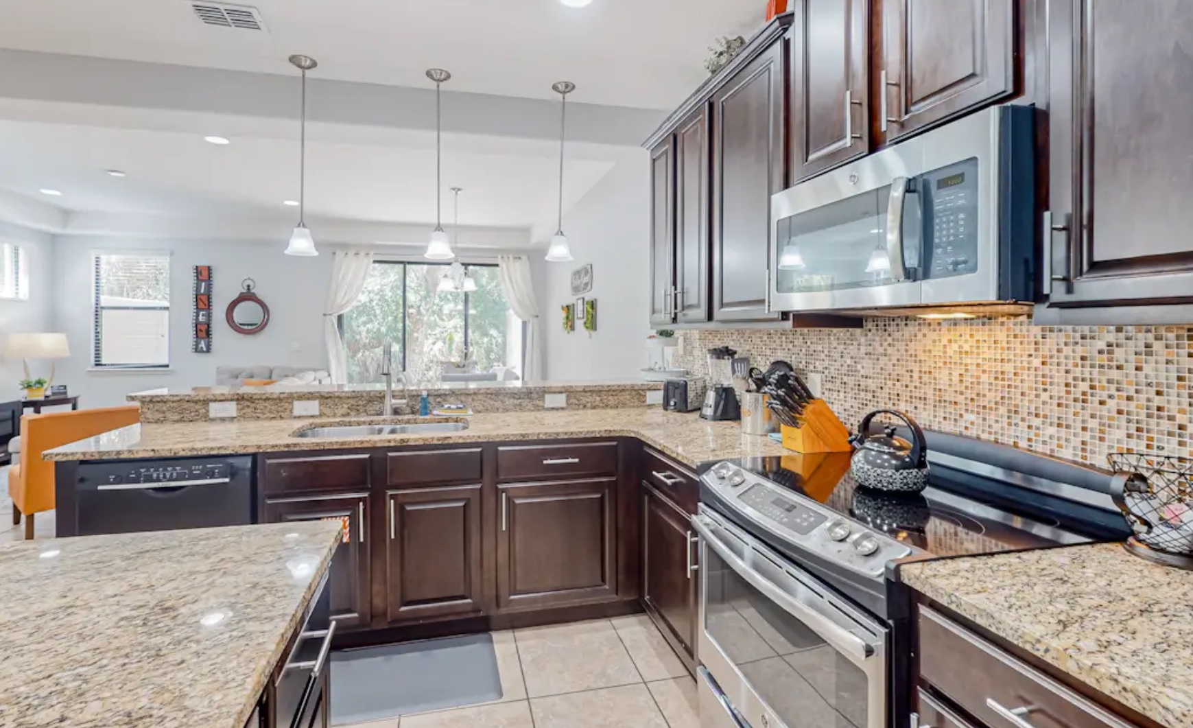 The open, airy kitchen offers ample space & all the comforts of home