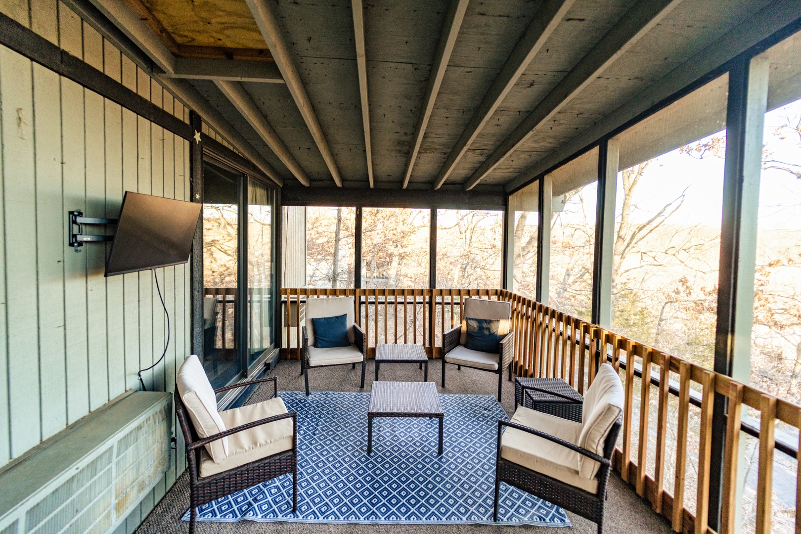The screened porch is ideal for enjoying a movie