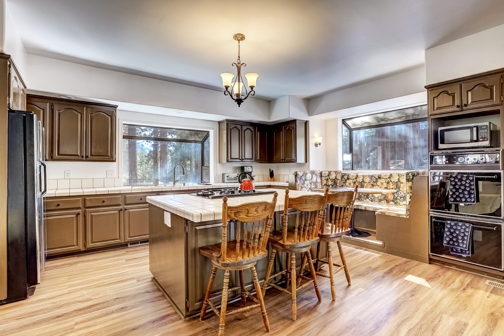 Kitchen with toaster oven, drip coffee pot, waffle maker, dishwasher and more