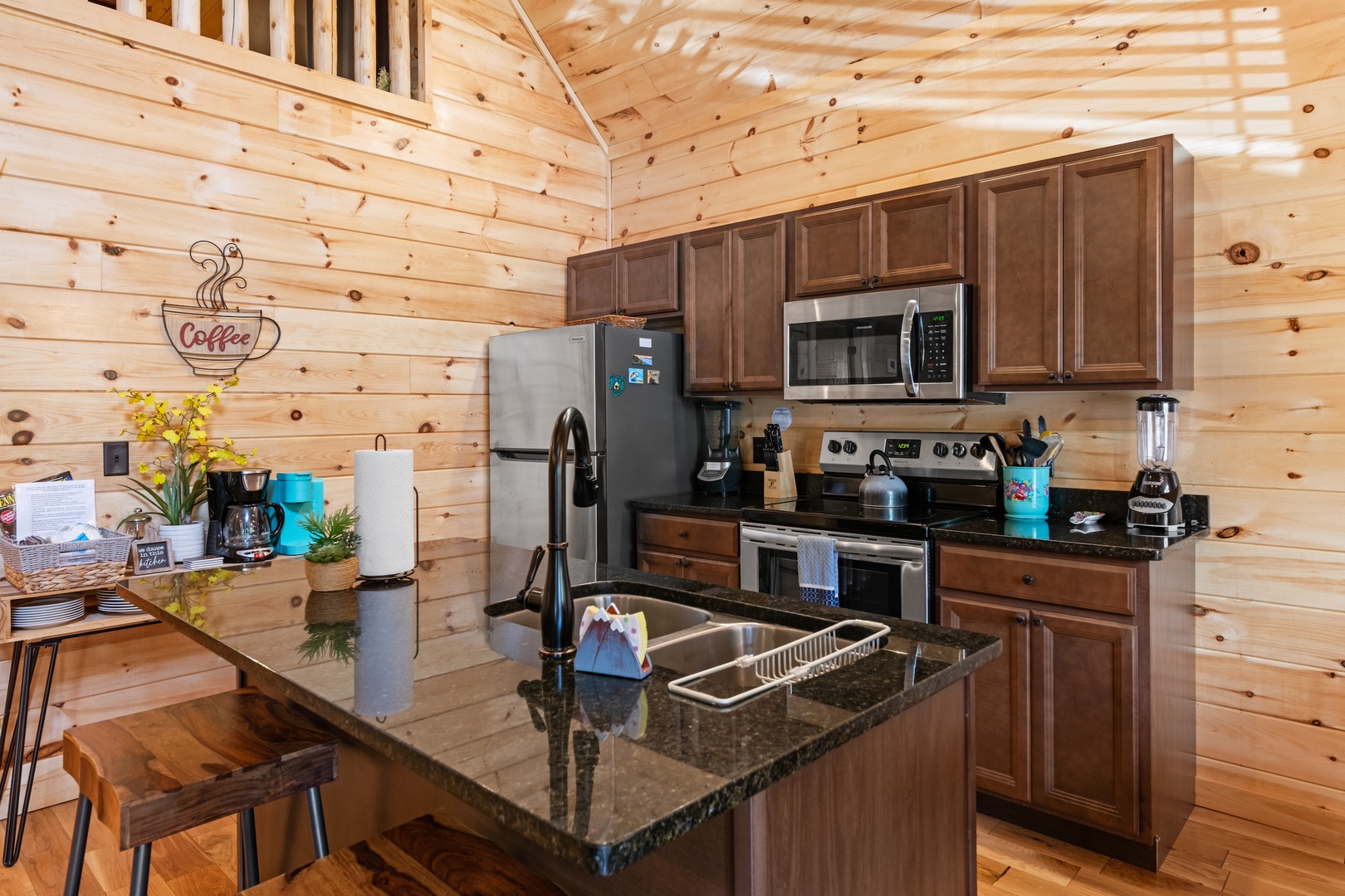 The open, airy kitchen offers ample space & every home comfort