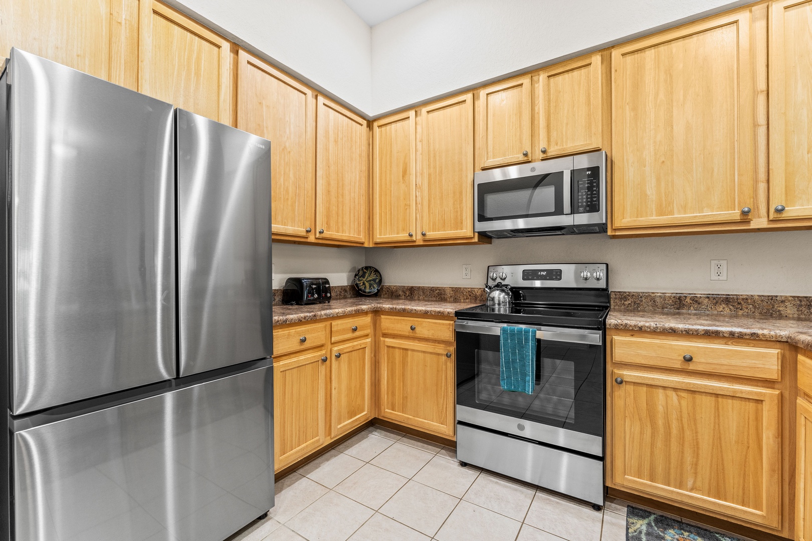 The cozy kitchen offers ample space & all the comforts of home