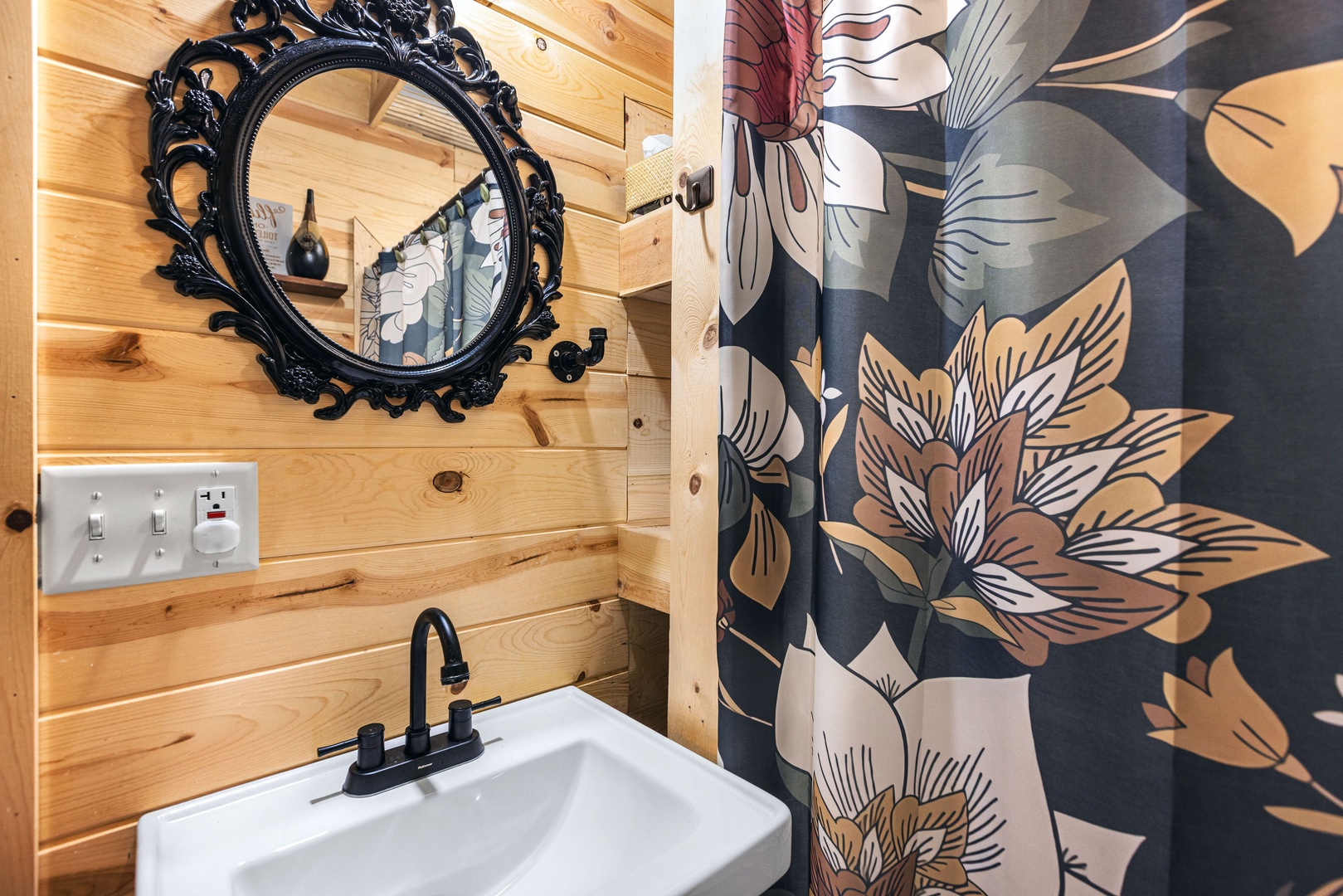 Bathroom with stand-up shower and stackable washer and dryer