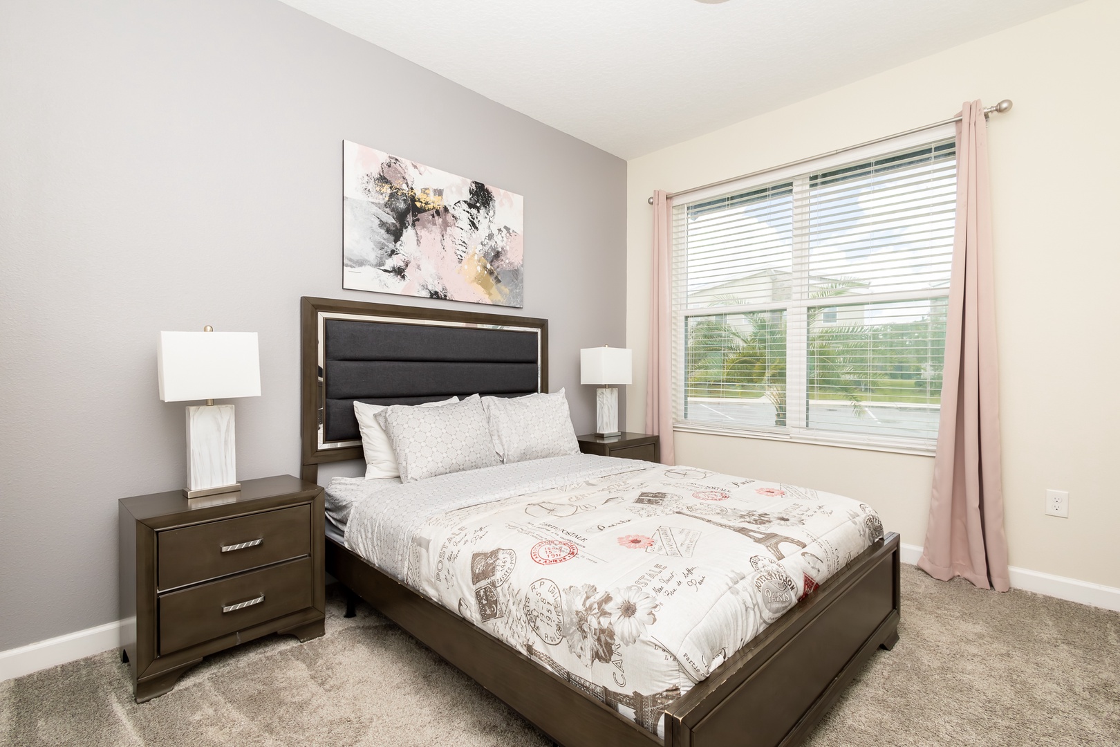 The second 1st-floor bedroom retreat features a plush queen bed & smart TV