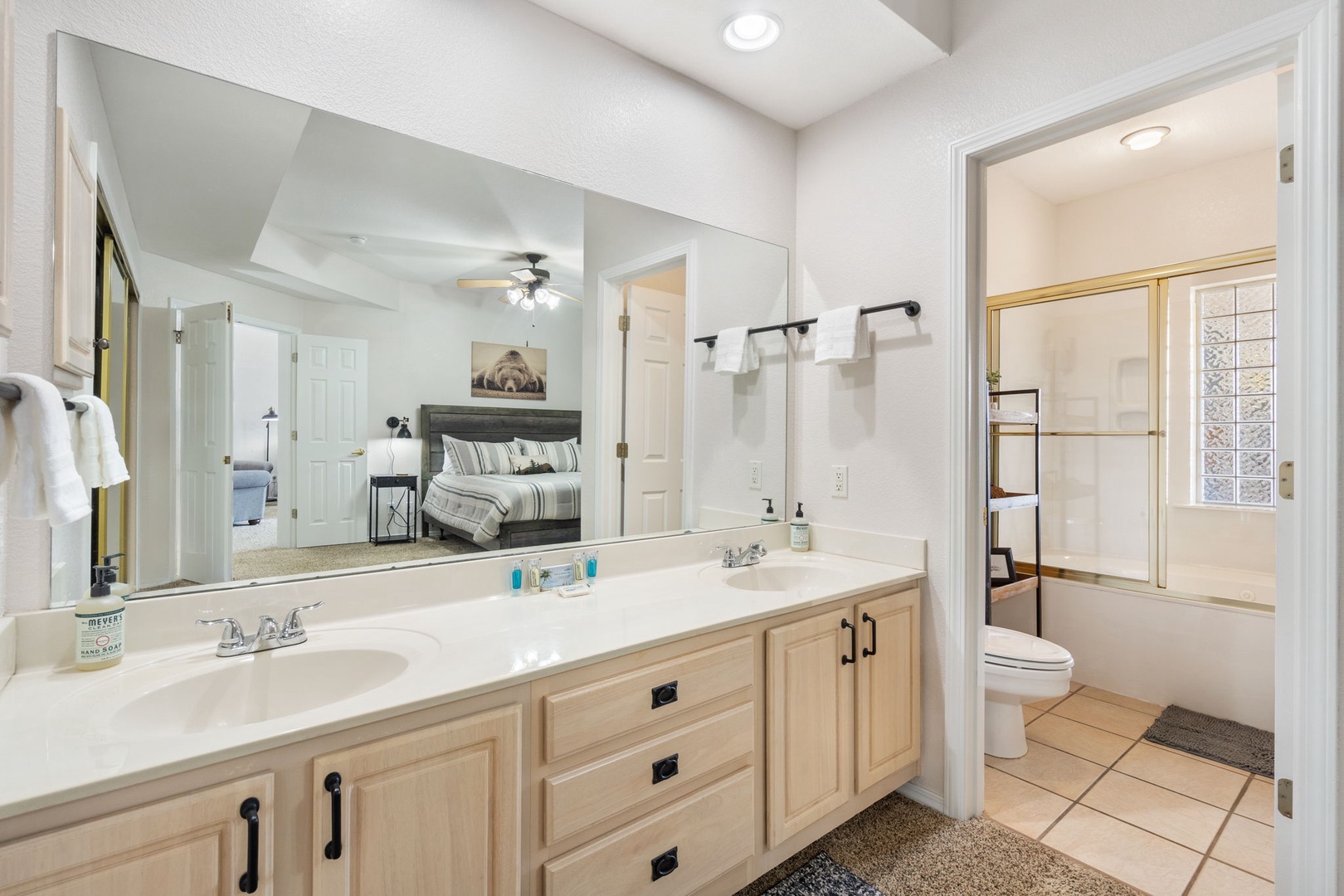 The king en suite bathroom includes a double vanity & shower/tub combo