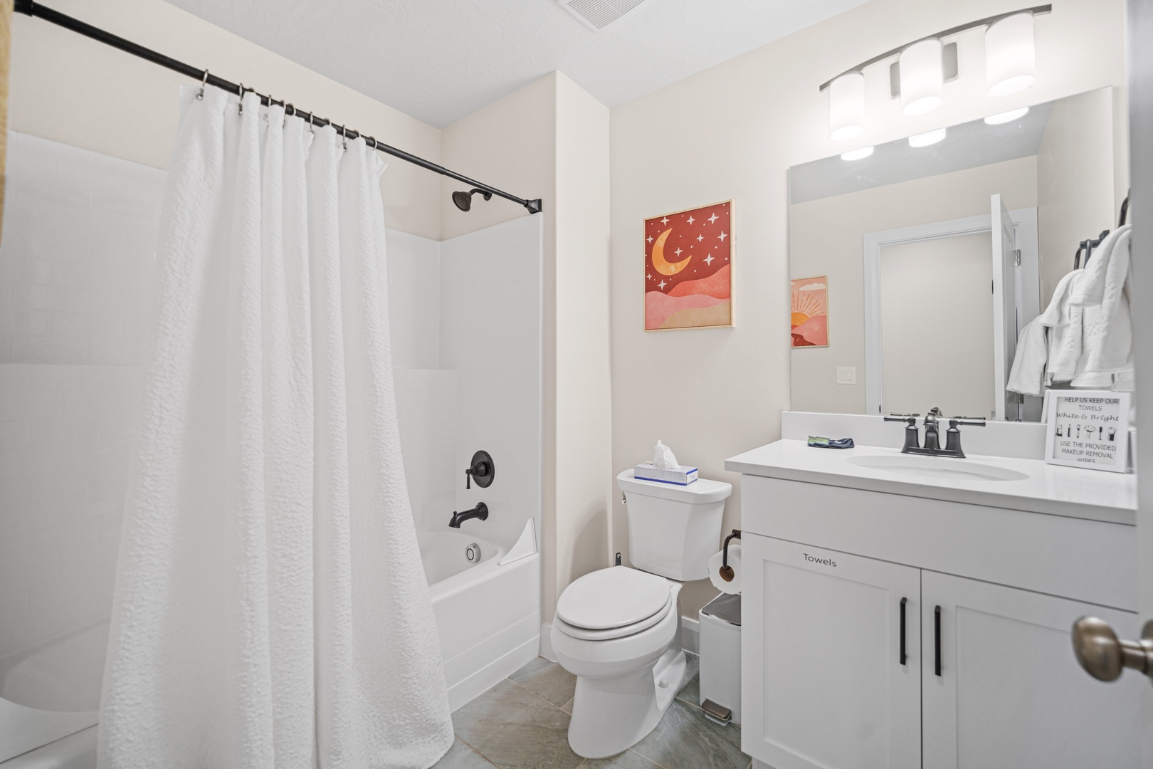 Shared bathroom with shower/tub combo