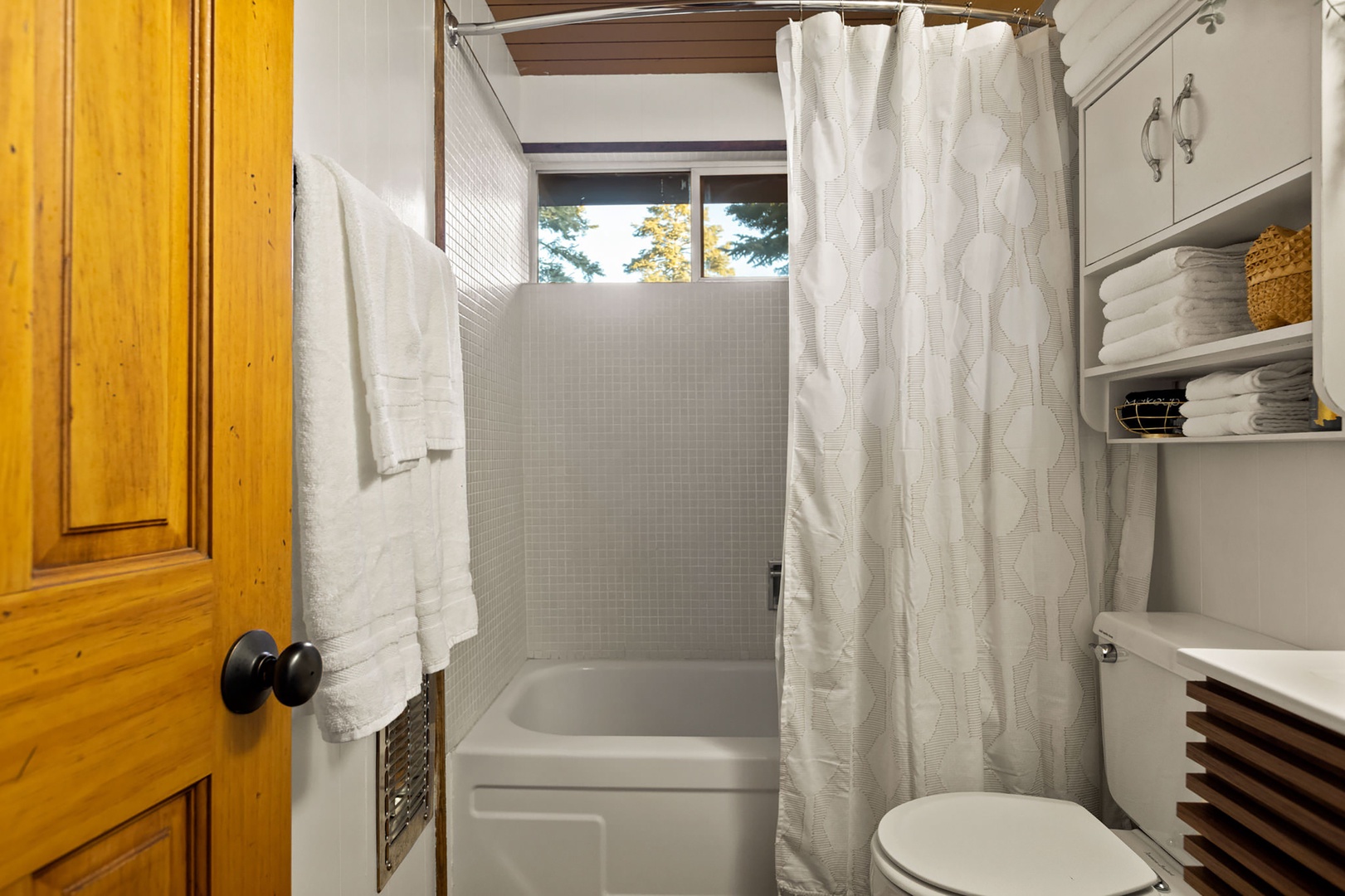 The full bath on the main level includes a single sink & shower/tub combo