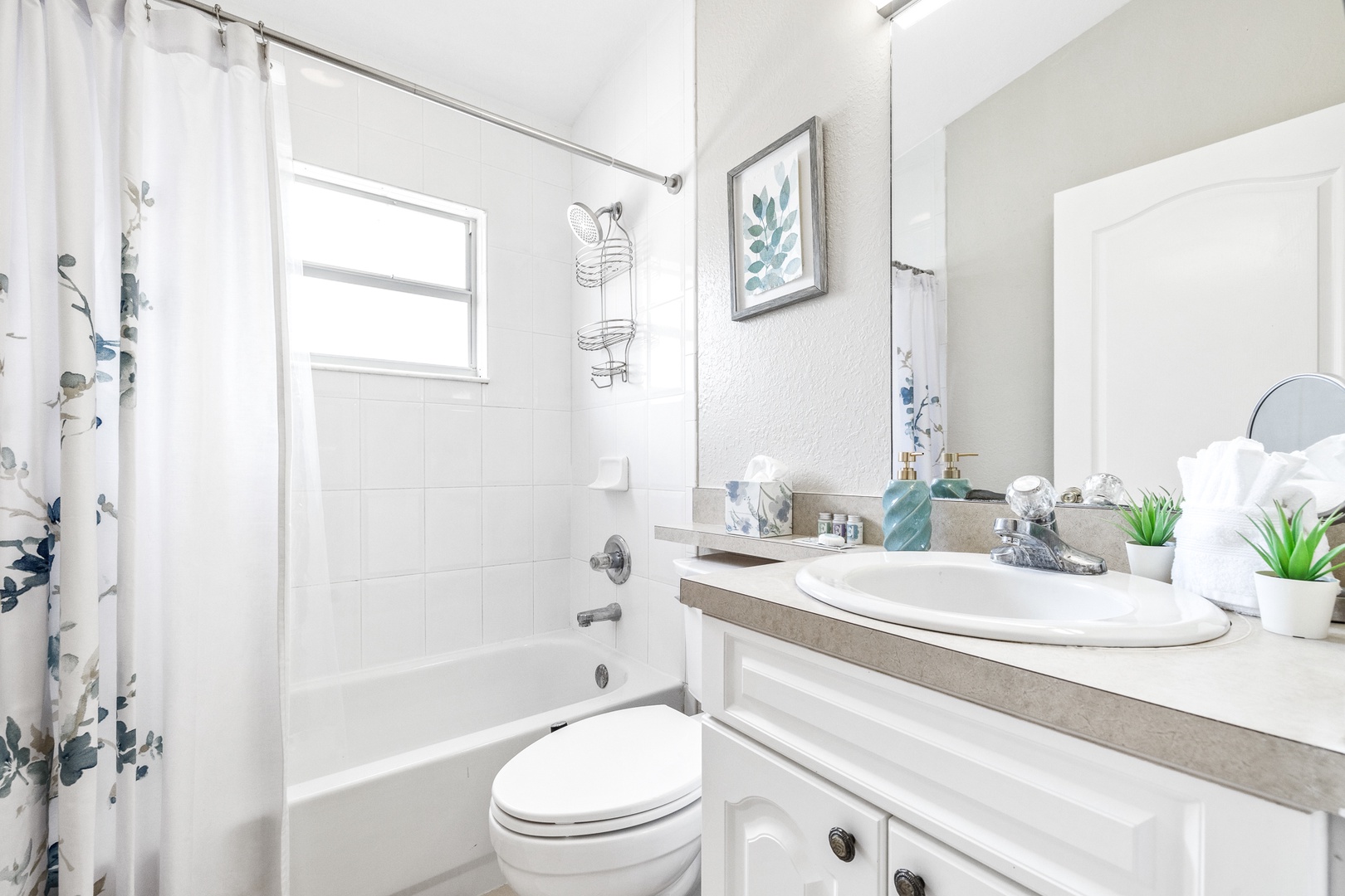 The hall bath features a single vanity & shower/tub combo