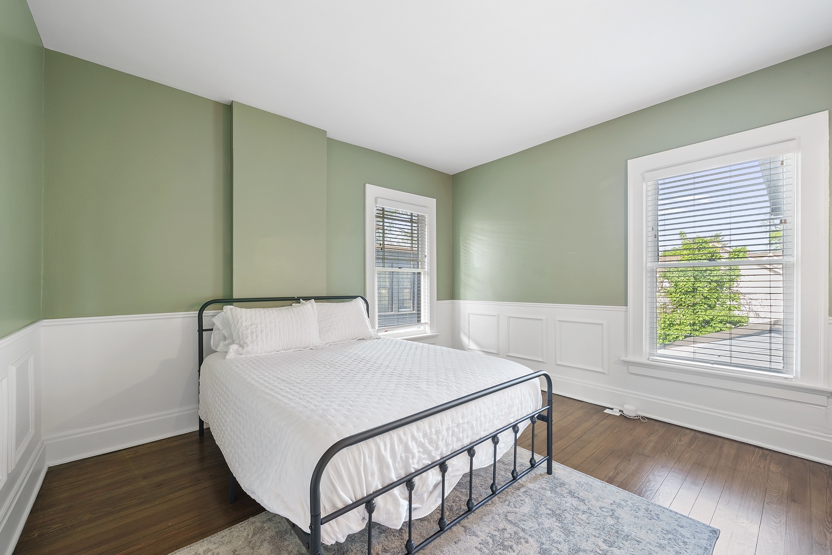 The final bedroom on the second floor features a plush queen-sized bed