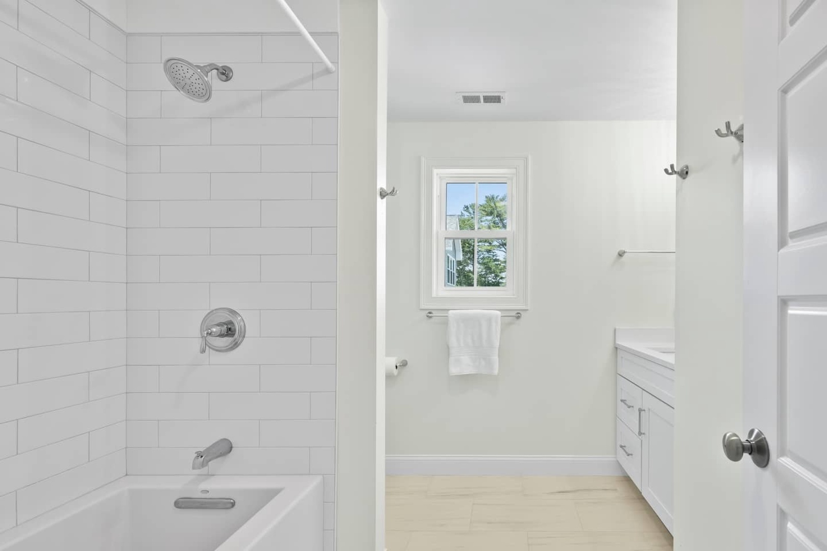 Shared bathroom with shower/tub combo