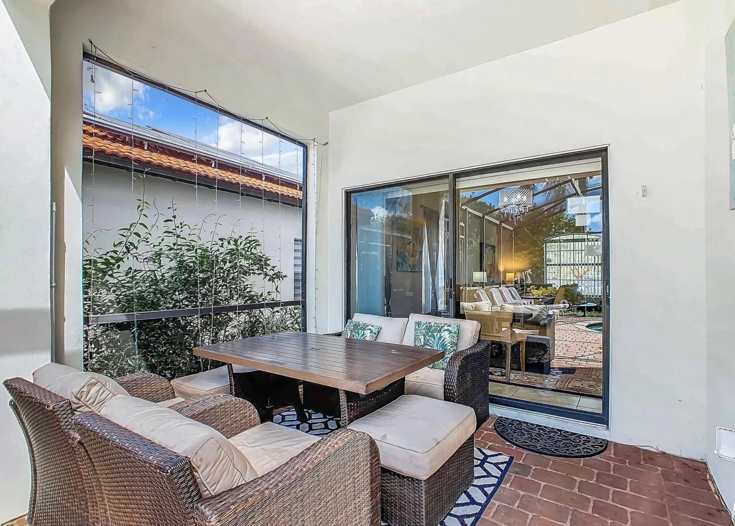 Private fenced in pool with outdoor seating