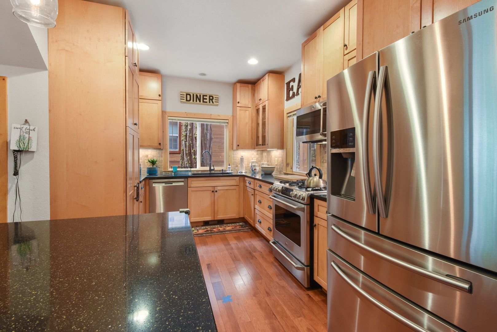 Kitchen with coffee maker, toaster, blender, stand mixer, and more