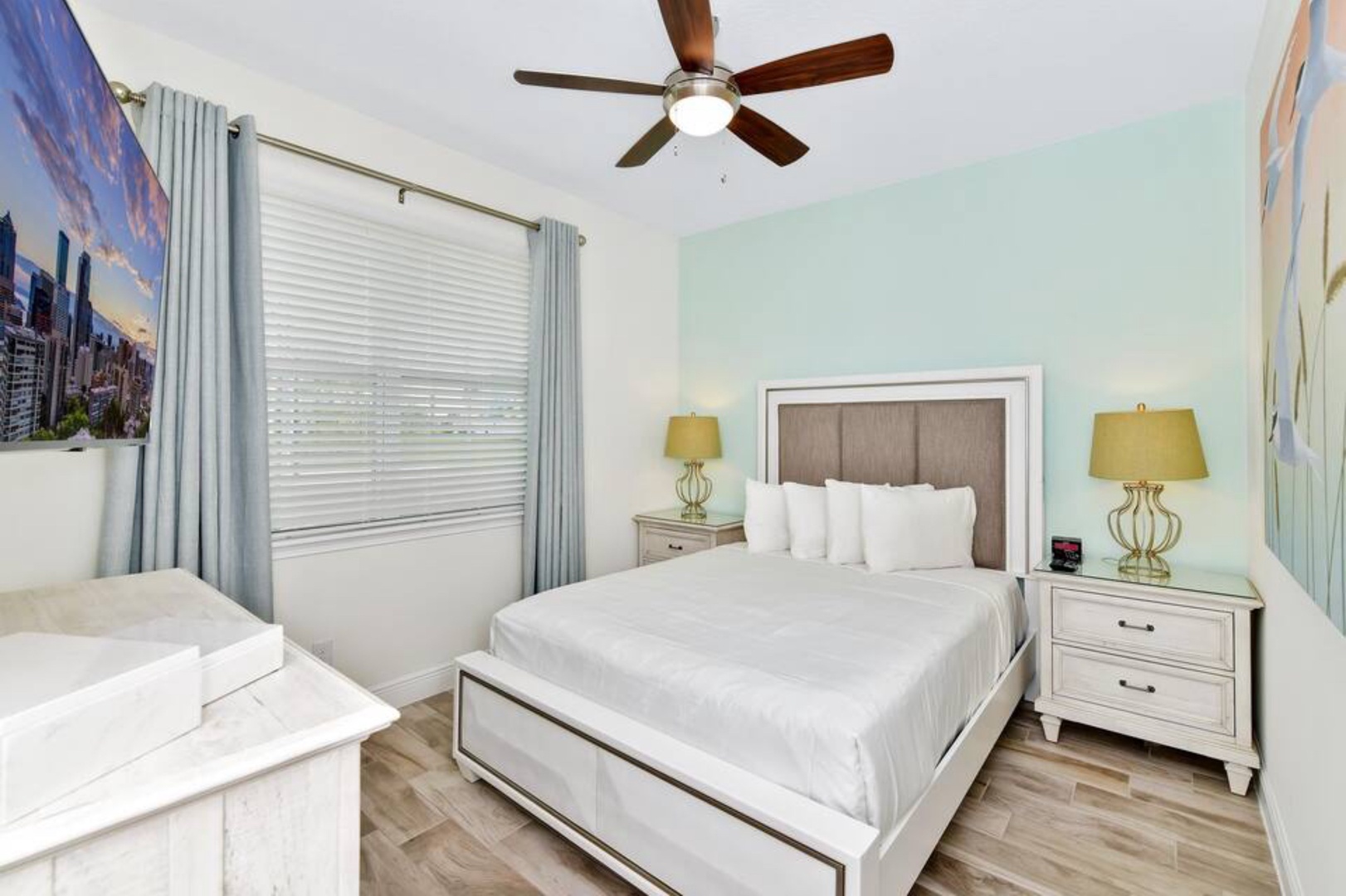 First floor bedroom with queen bed, smart TV & ceiling fan