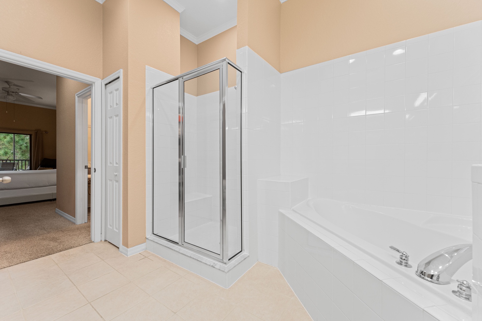 The king ensuite features a double vanity, shower, & luxe soaking tub