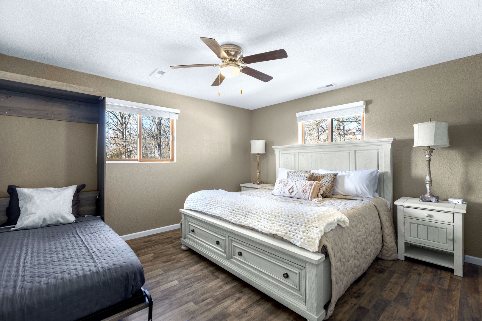 The 1st of 6 spacious bedrooms offers a king bed & twin murphy bed