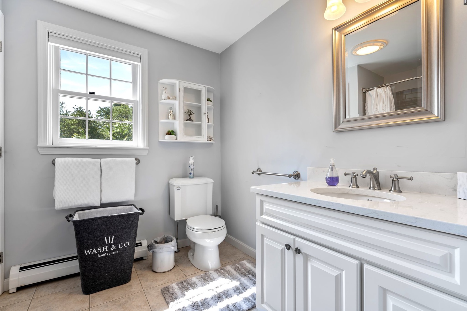 The shared 2nd floor full bath includes a single vanity & shower/tub combo