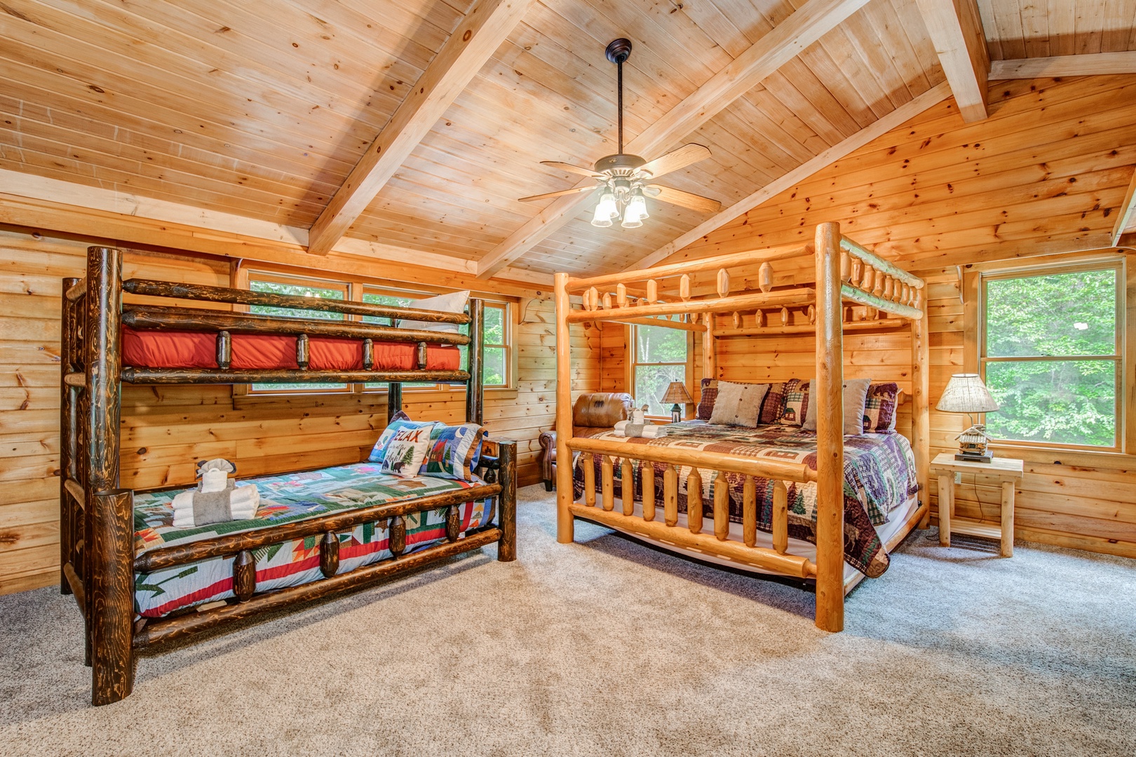Loft sleeping area, with king bed, twin-over-full bunks, & attached bathroom
