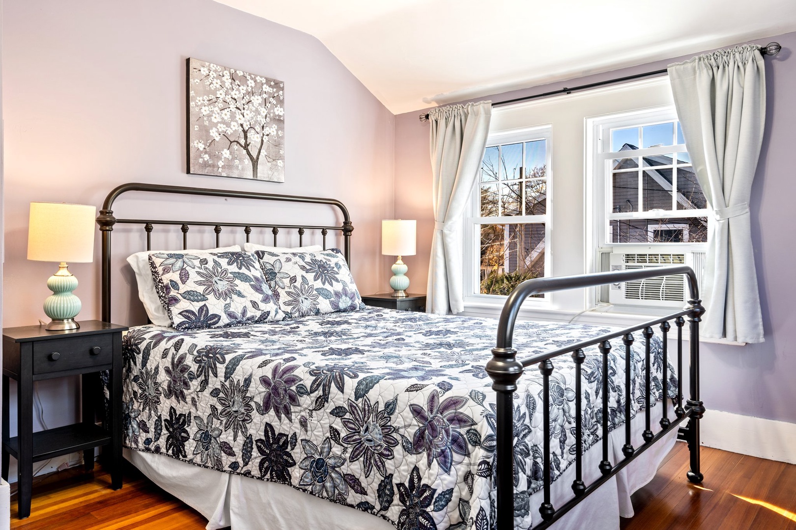 The 2nd floor queen bedroom showcases a cozy bed