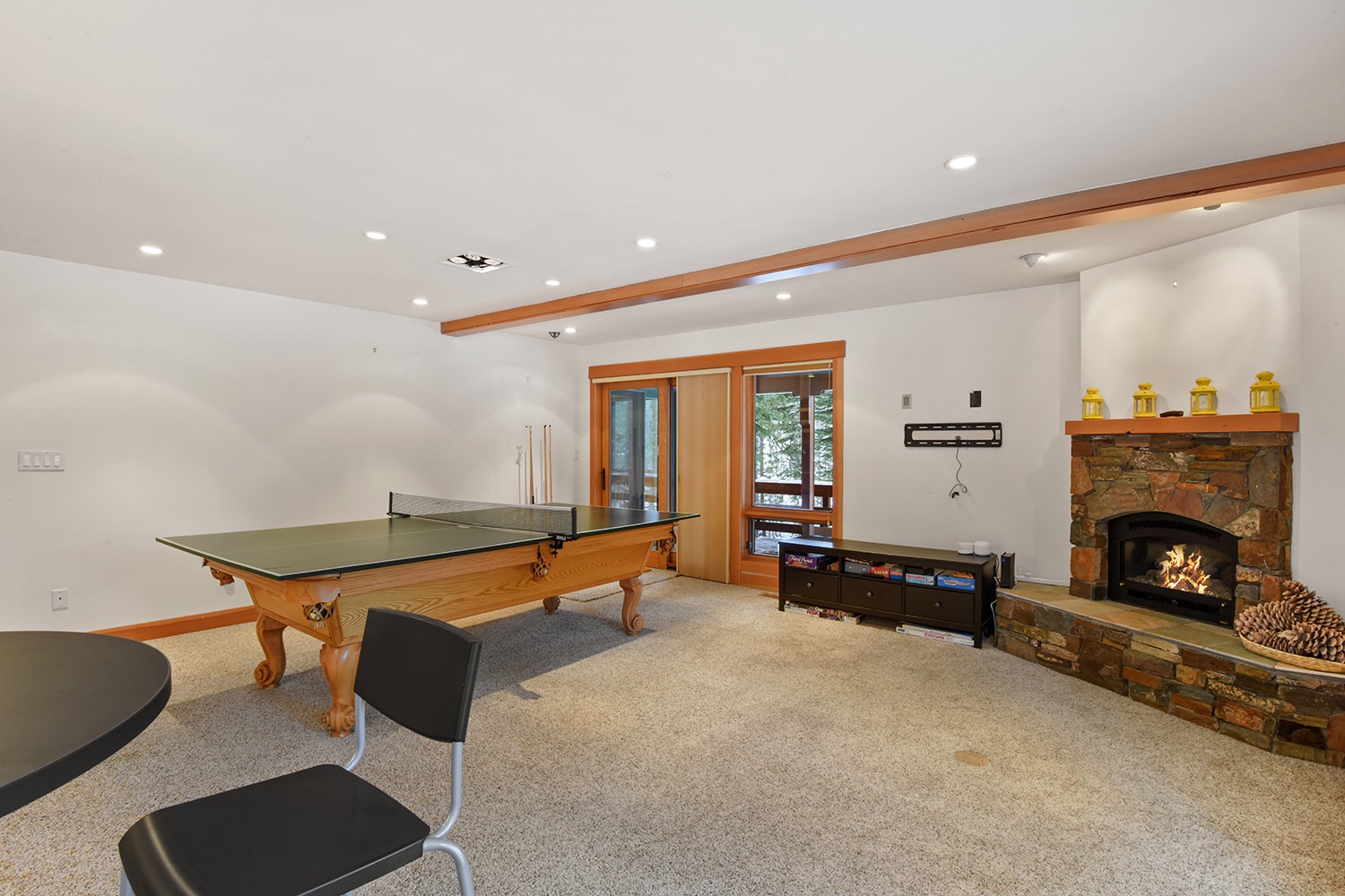 Game room with pool table, games, and fireplace (downstairs)
