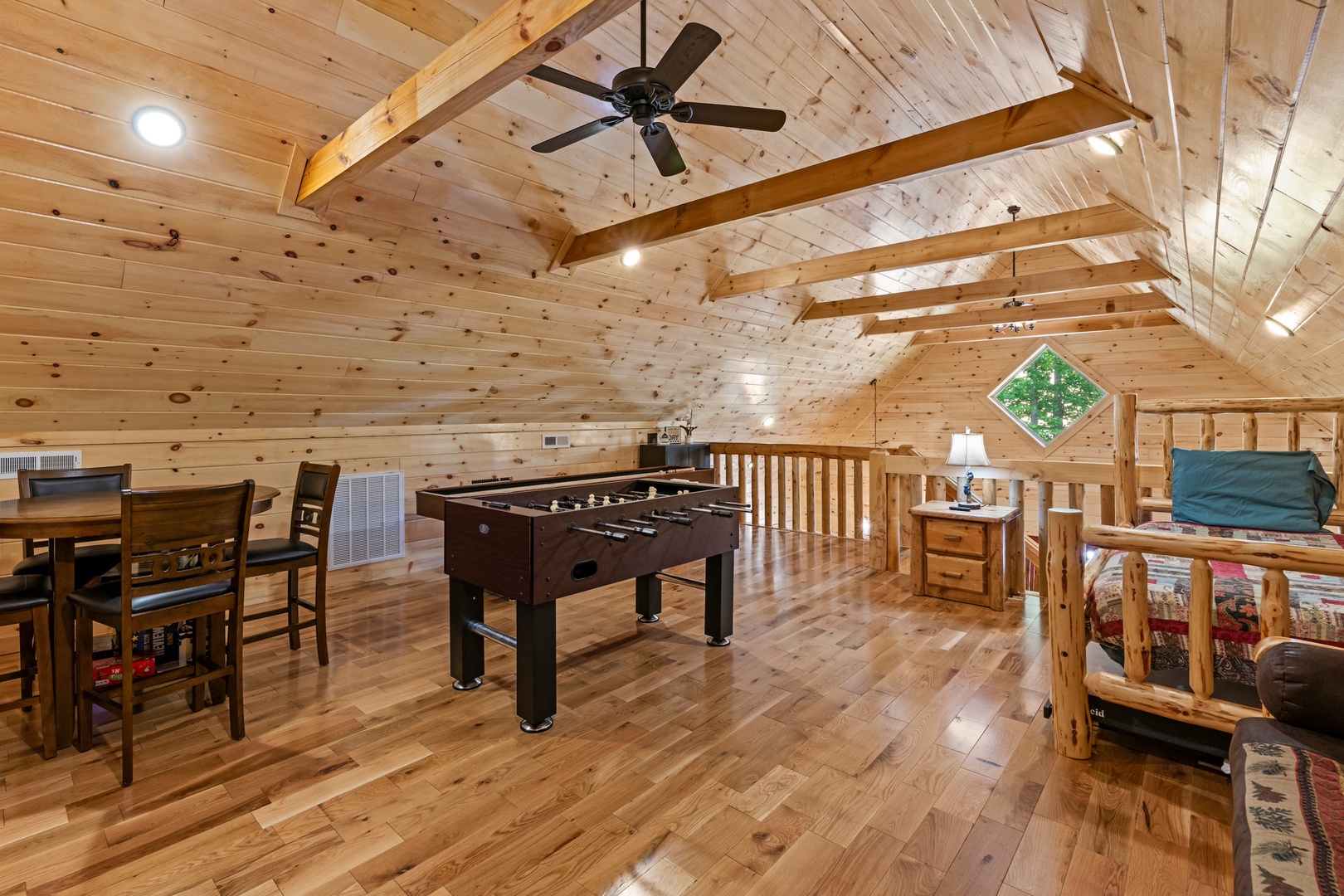 Game & relax in the loft, offering a futon & twin bed/trundle combo