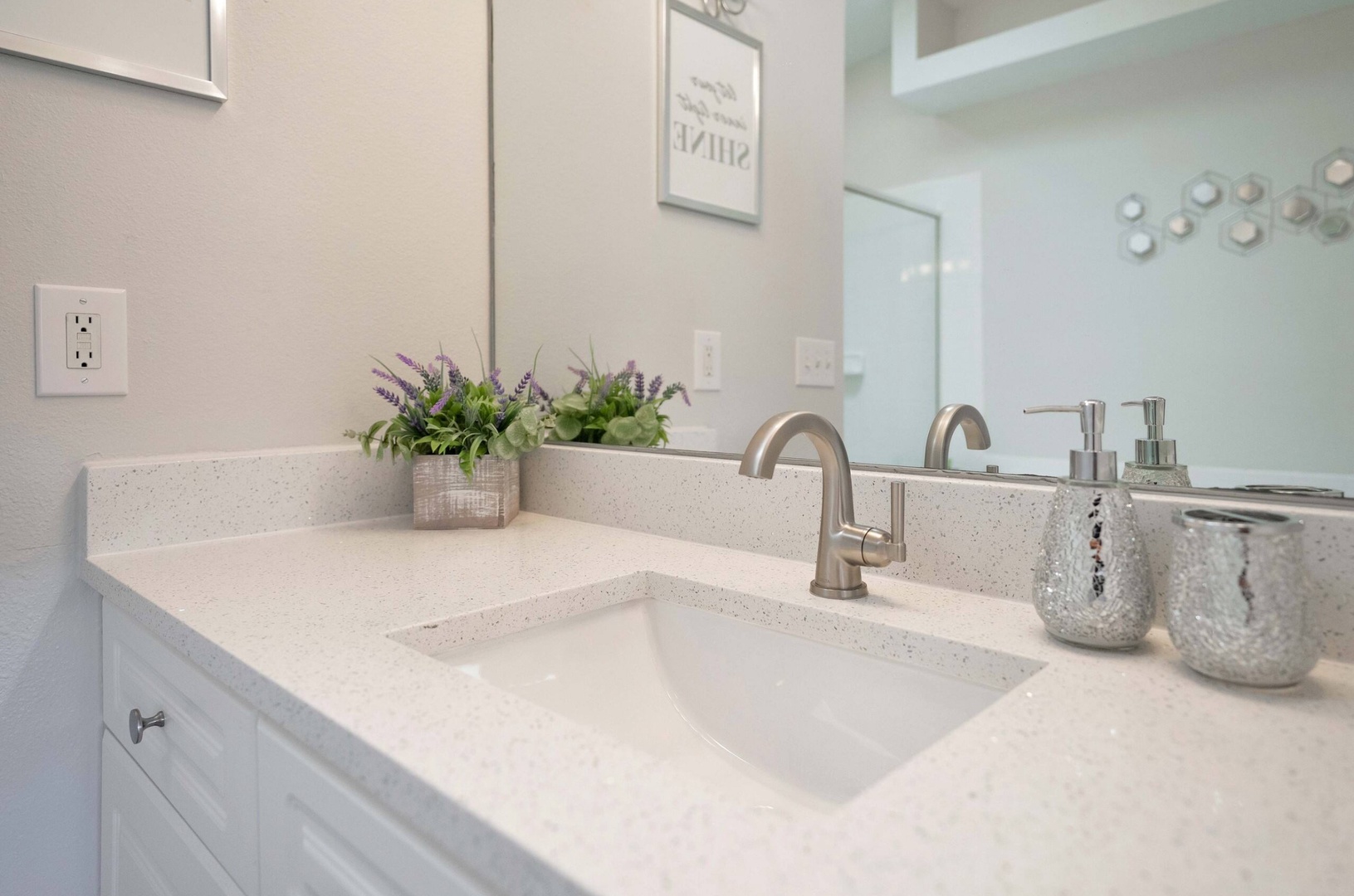 An oversized vanity, shower and soaking tub await in this large ensuite bath