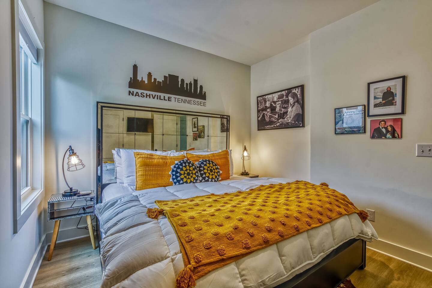 This stylish second floor bedroom offers guests a cozy king bed & Smart TV
