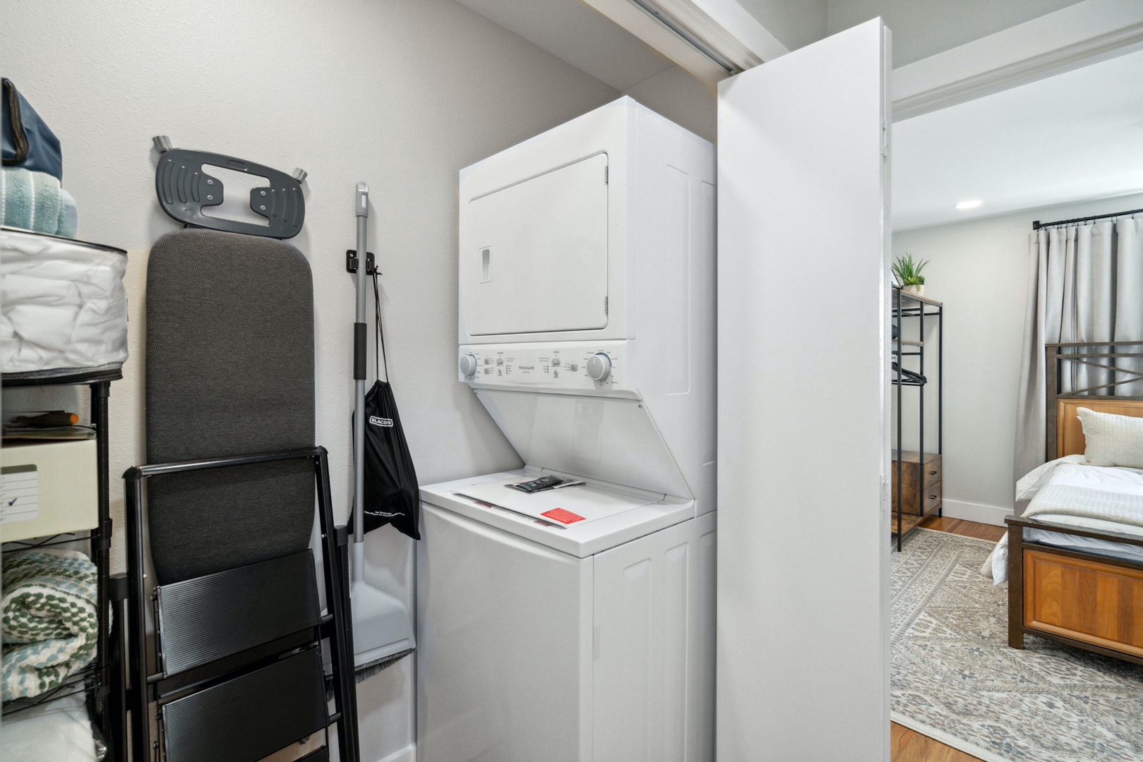 Private laundry is available for your stay, tucked away near the full bath