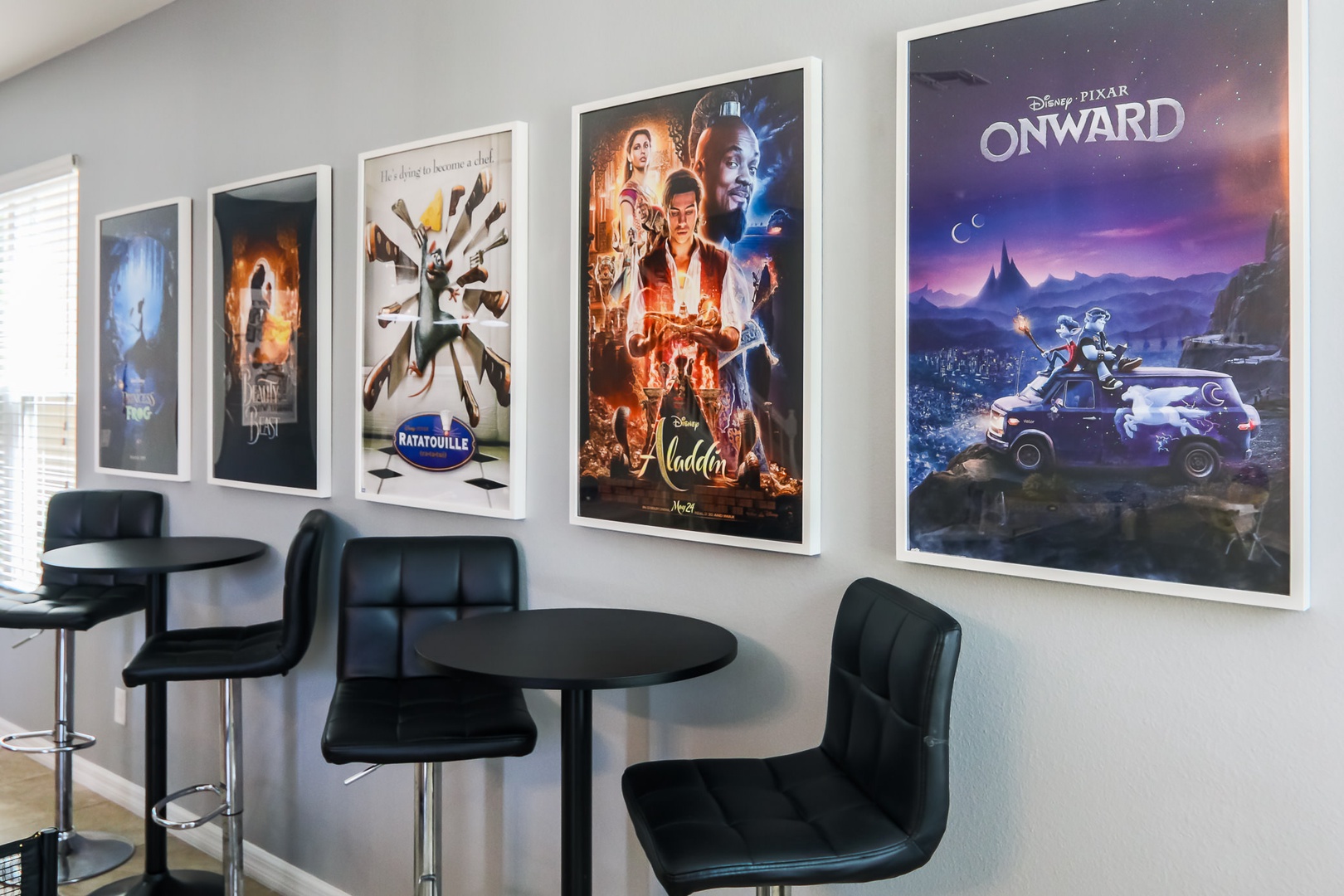 Indoor game room with movie posters