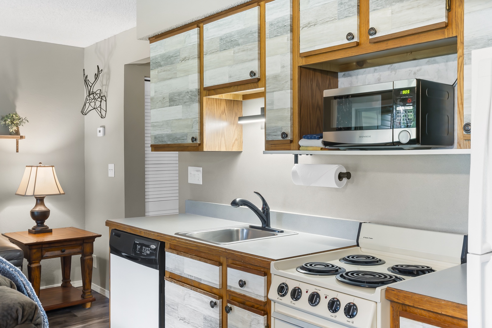 The open, airy kitchen offers ample storage & all the comforts of home