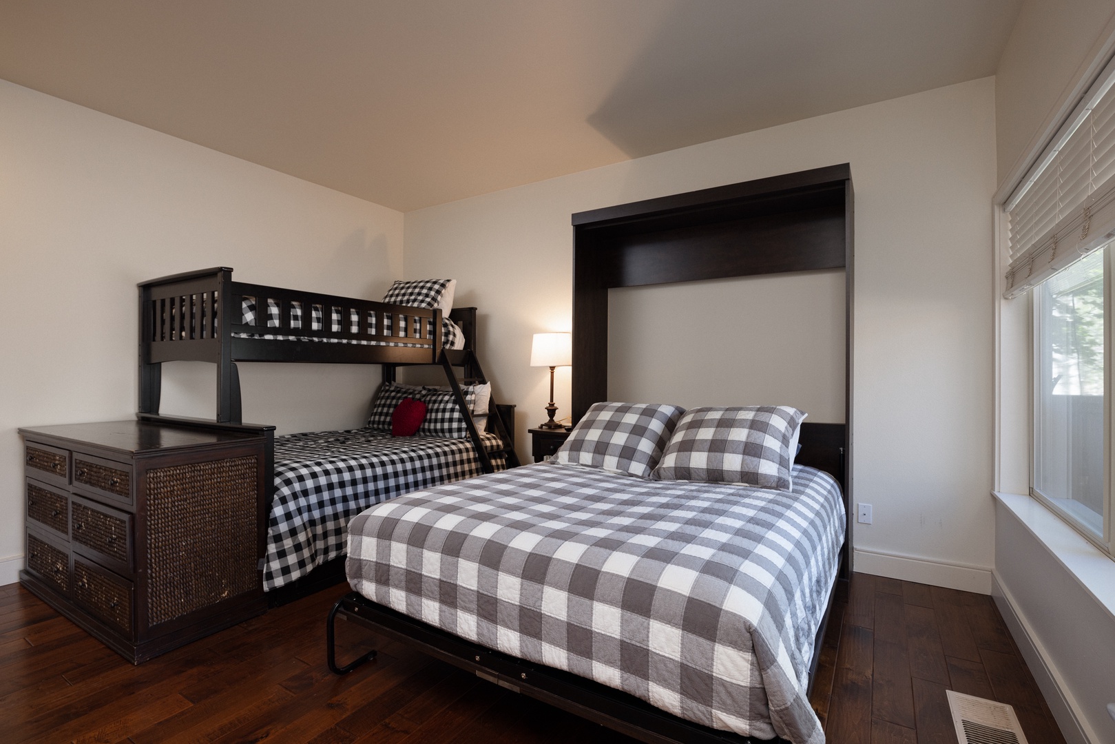 This 1st-floor suite offers a twin-over-full bunkbed & queen Murphy bed