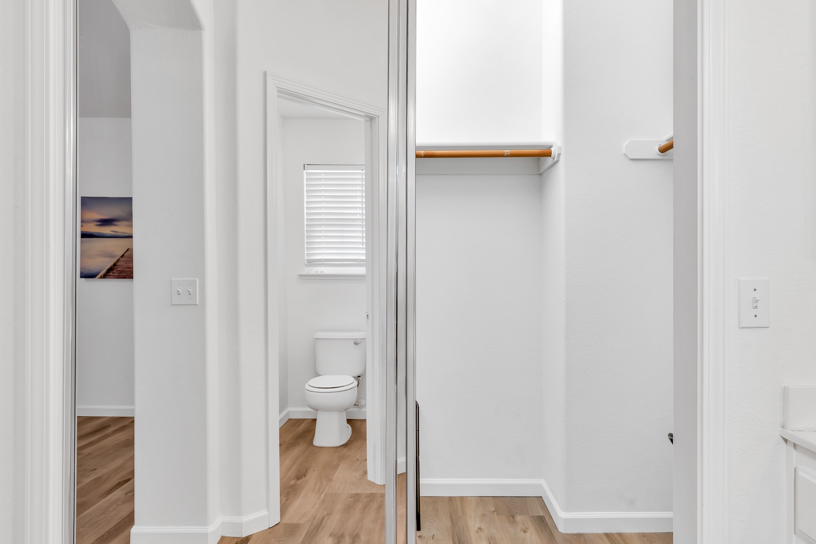 The king en suite boasts a double vanity, shower/tub combo, & walk-in closet