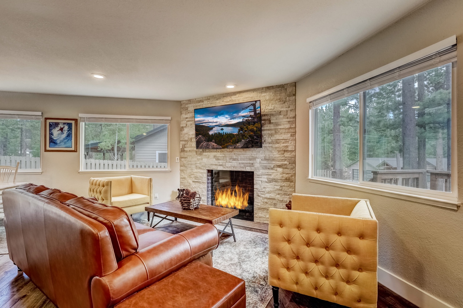 Living room with comfortable seating around a gas fireplace and Smart TV