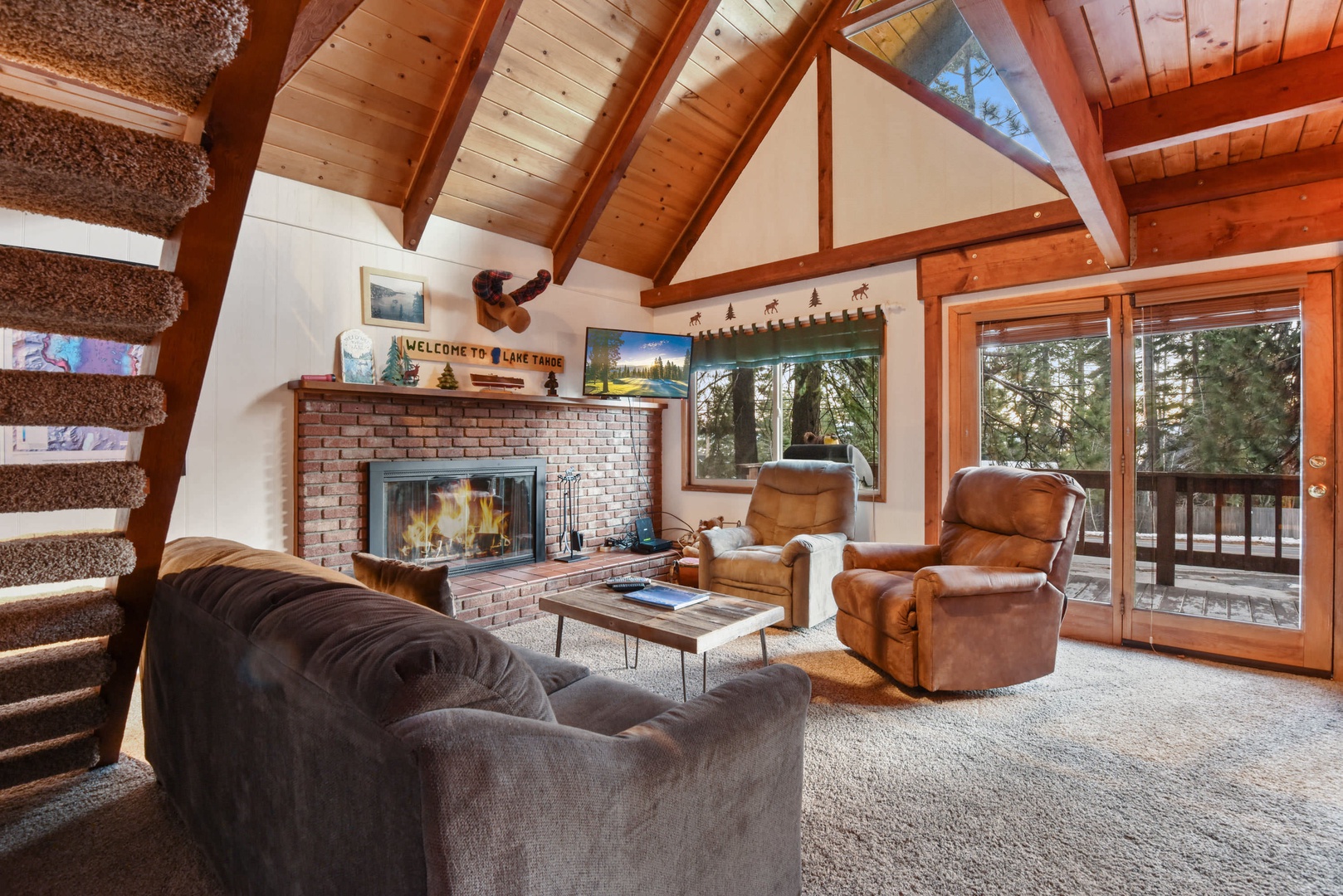 Mountain style living room with fireplace, flat screen TV, wifi, and DVD player