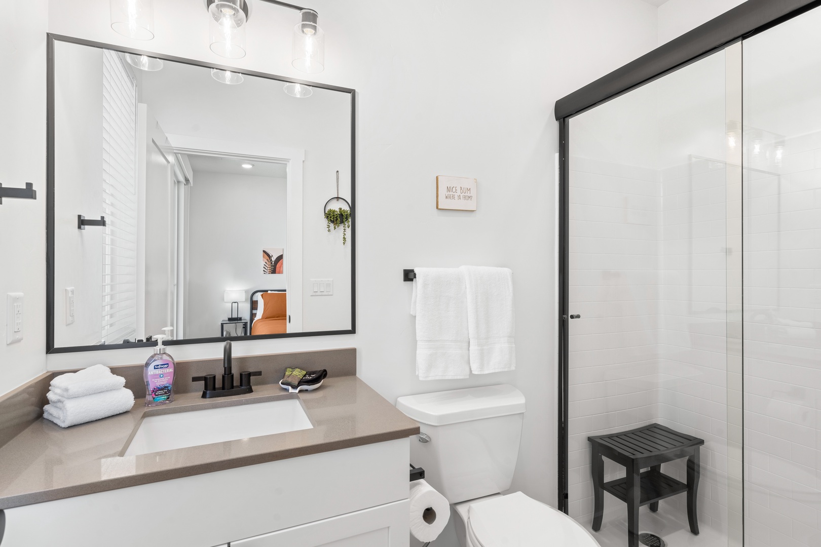 A single vanity & glass shower await in this 2nd-floor ensuite bath