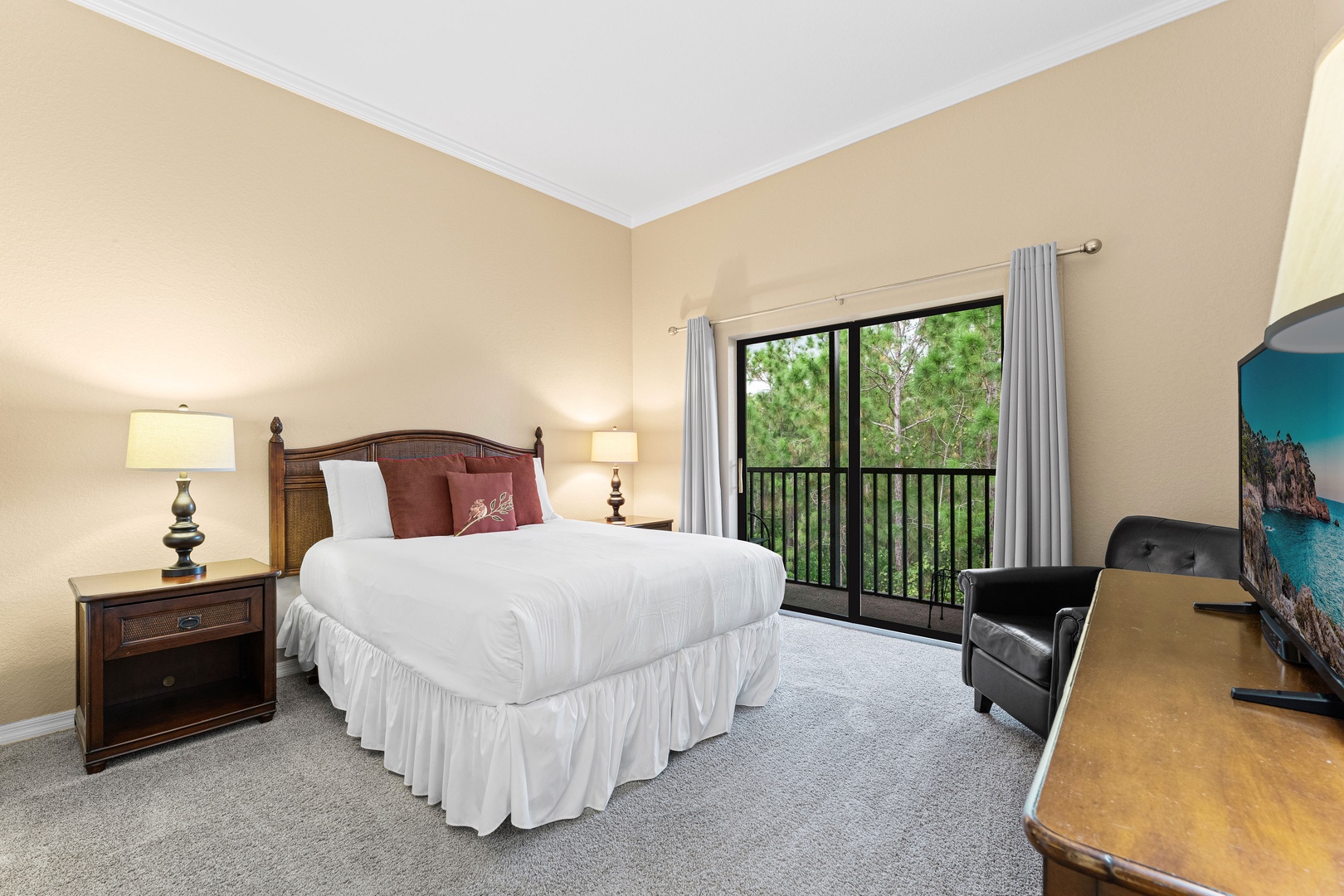 Recharge in the queen suite, featuring a TV, Jack & Jill ensuite, & balcony