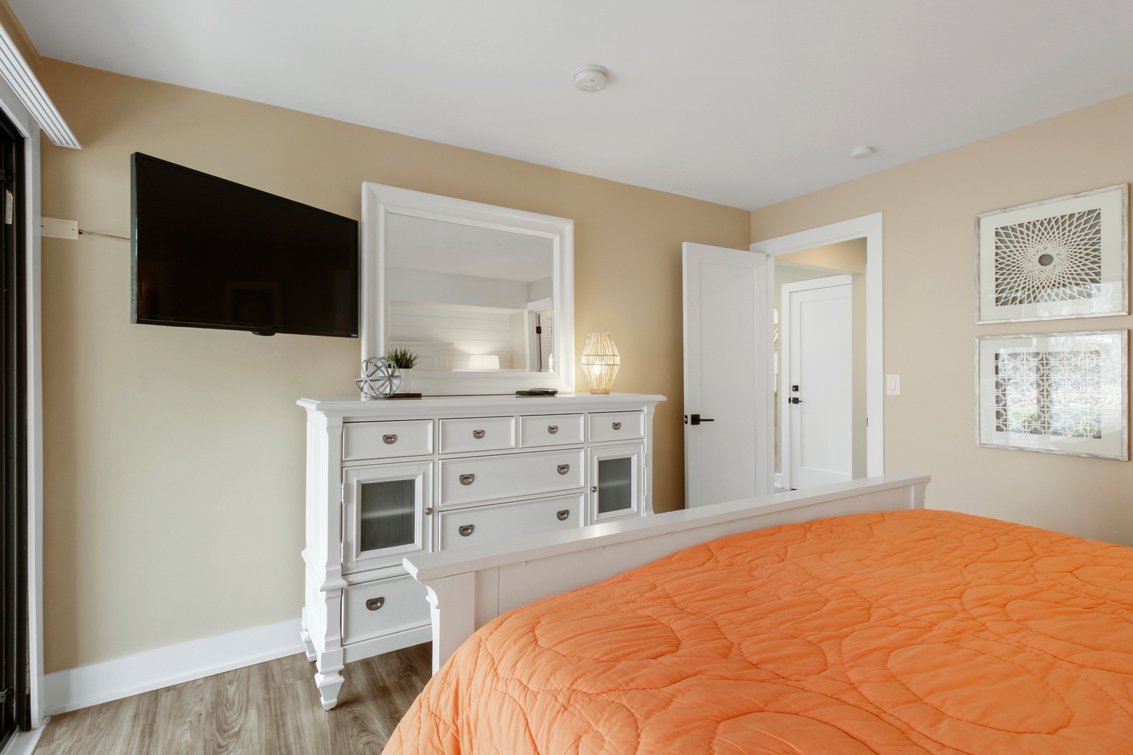 This bedroom sanctuary features a luxurious king-sized bed and deck access.