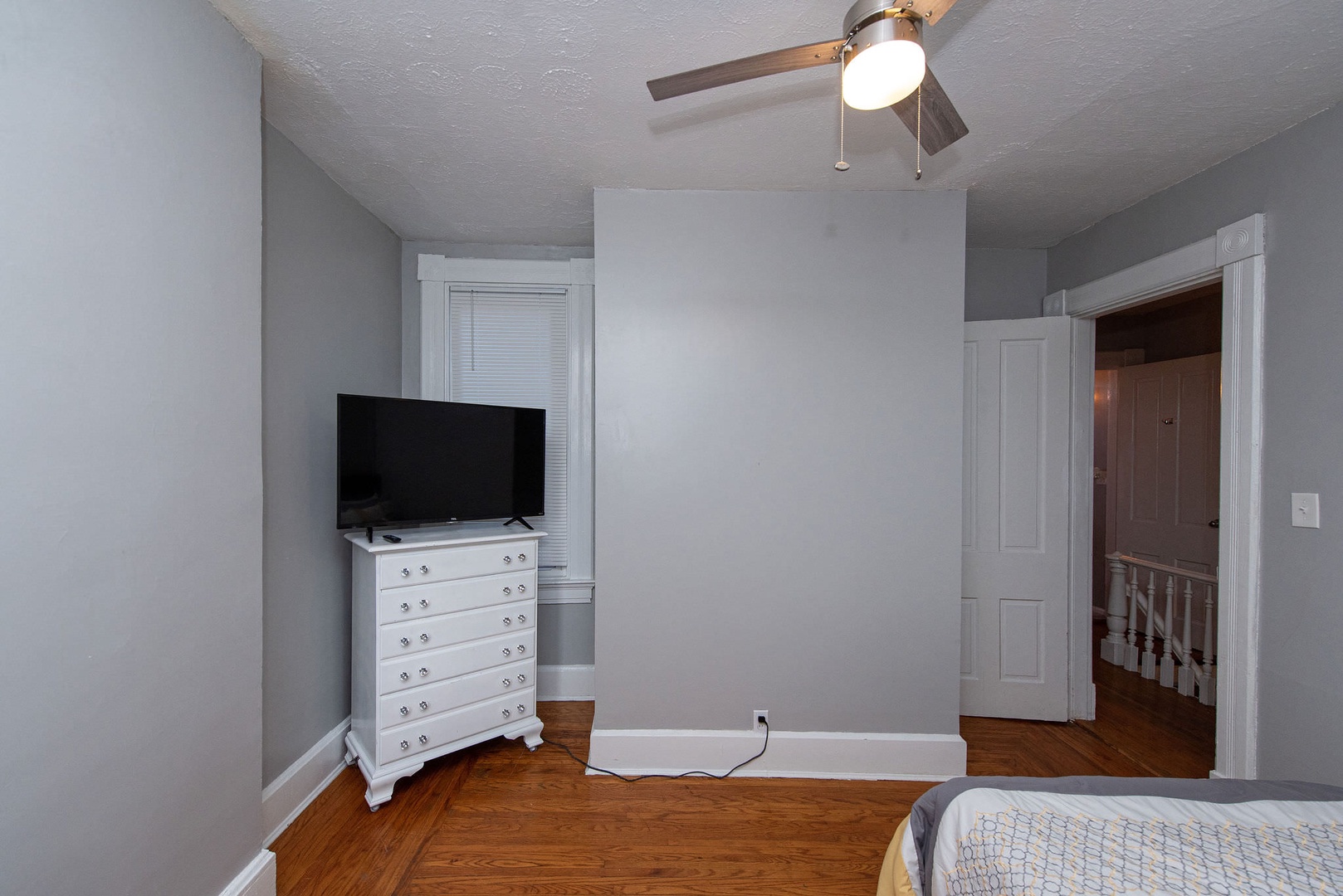 The 2nd of 3 bedrooms offers a full bed, Smart TV, & desk/workspace