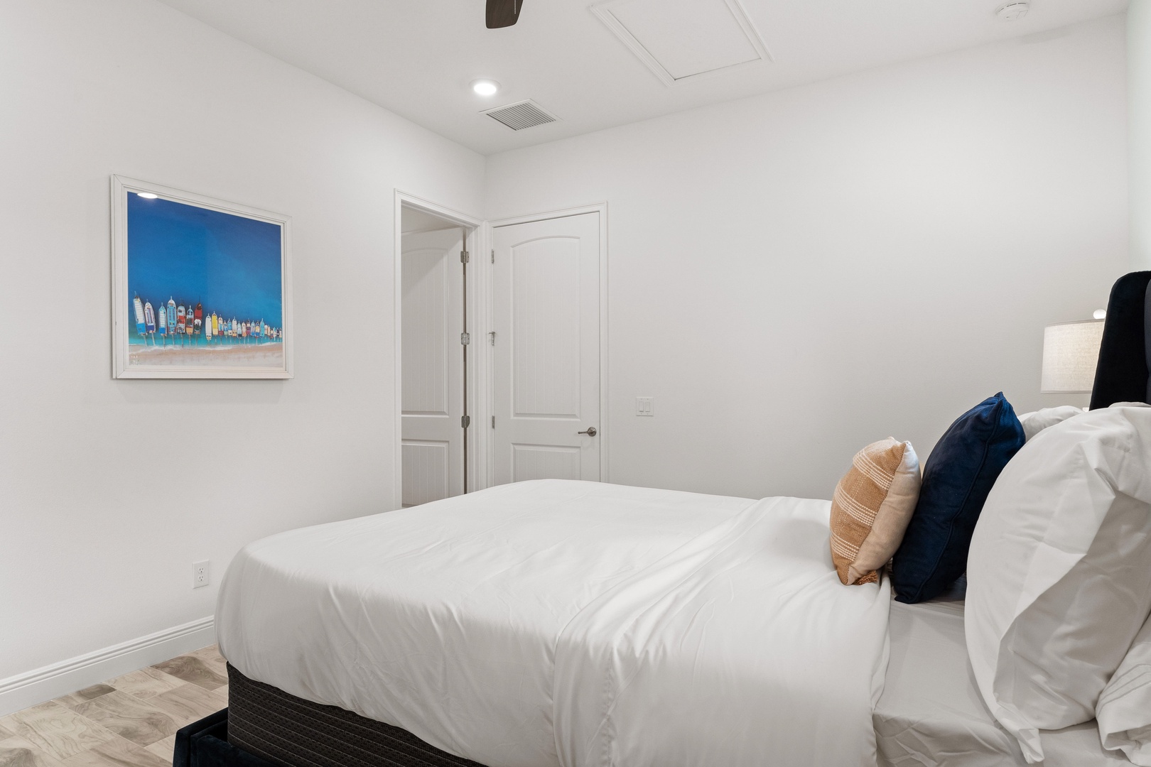 Coastal elegance awaits in this main-level queen bedroom, with ensuite bath