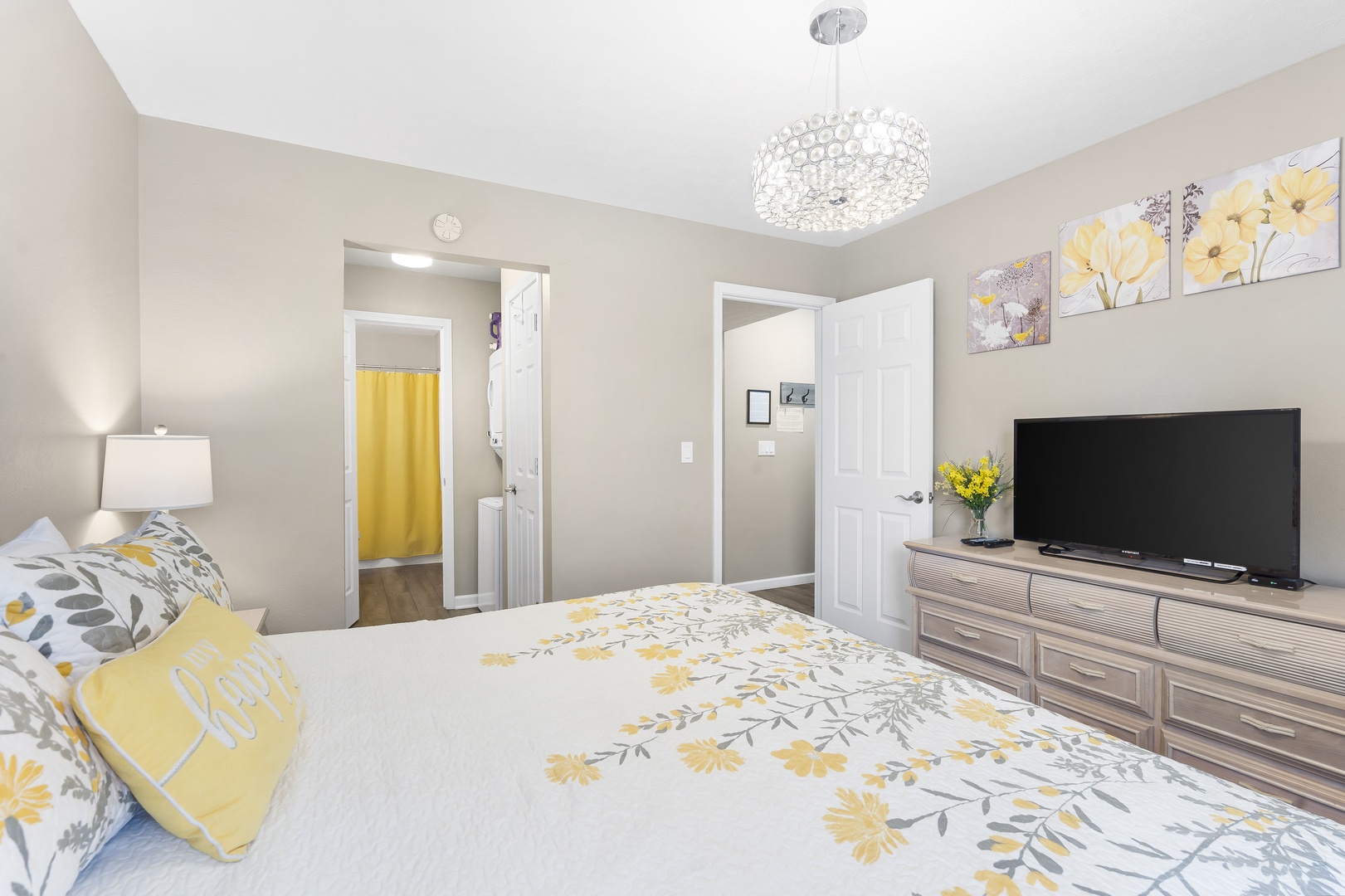 The cheerful king suite showcases an ensuite bath & Smart TV