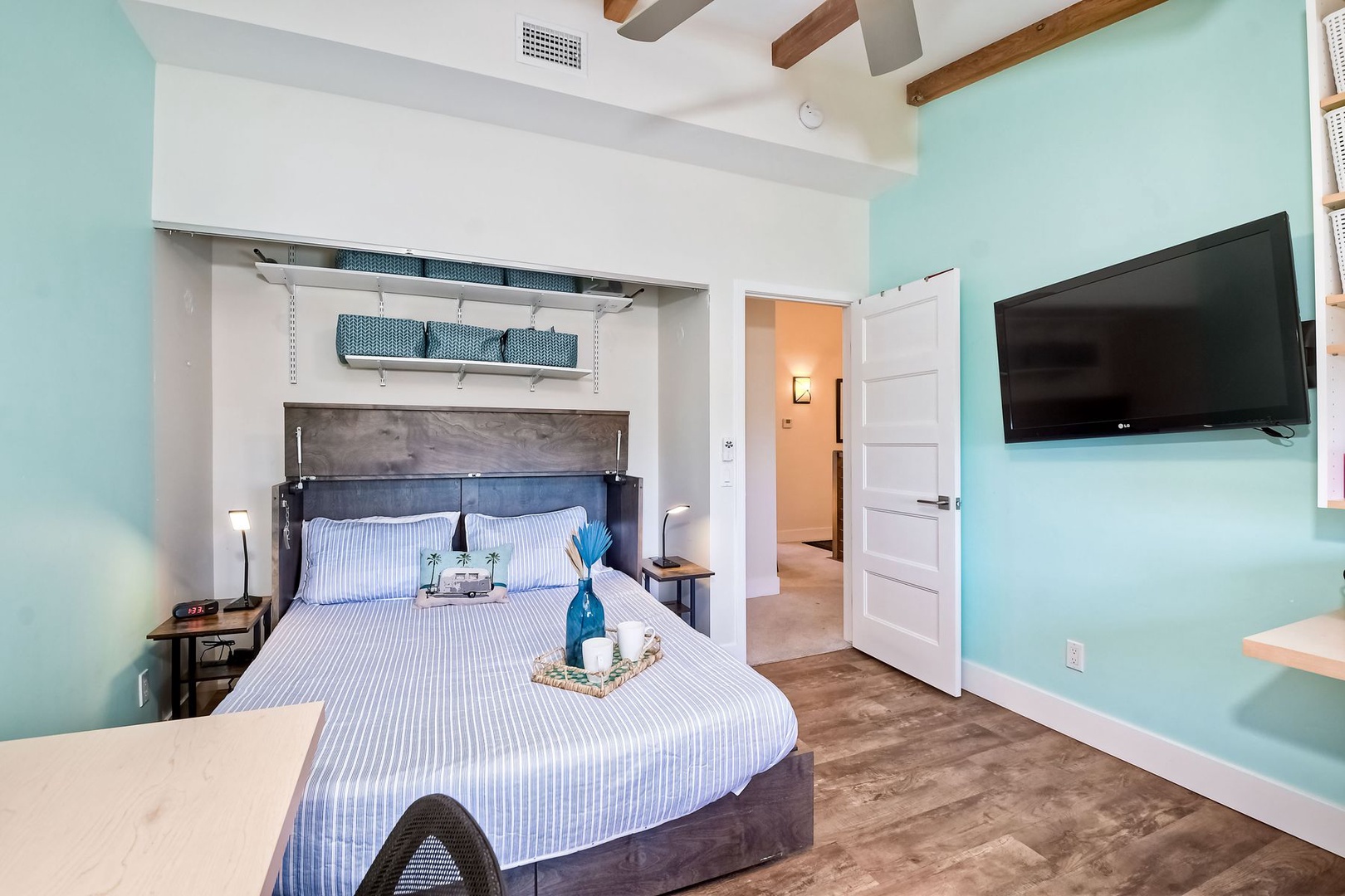 The final bedroom is a crafter’s dream, with a queen Murphy bed & Smart TV