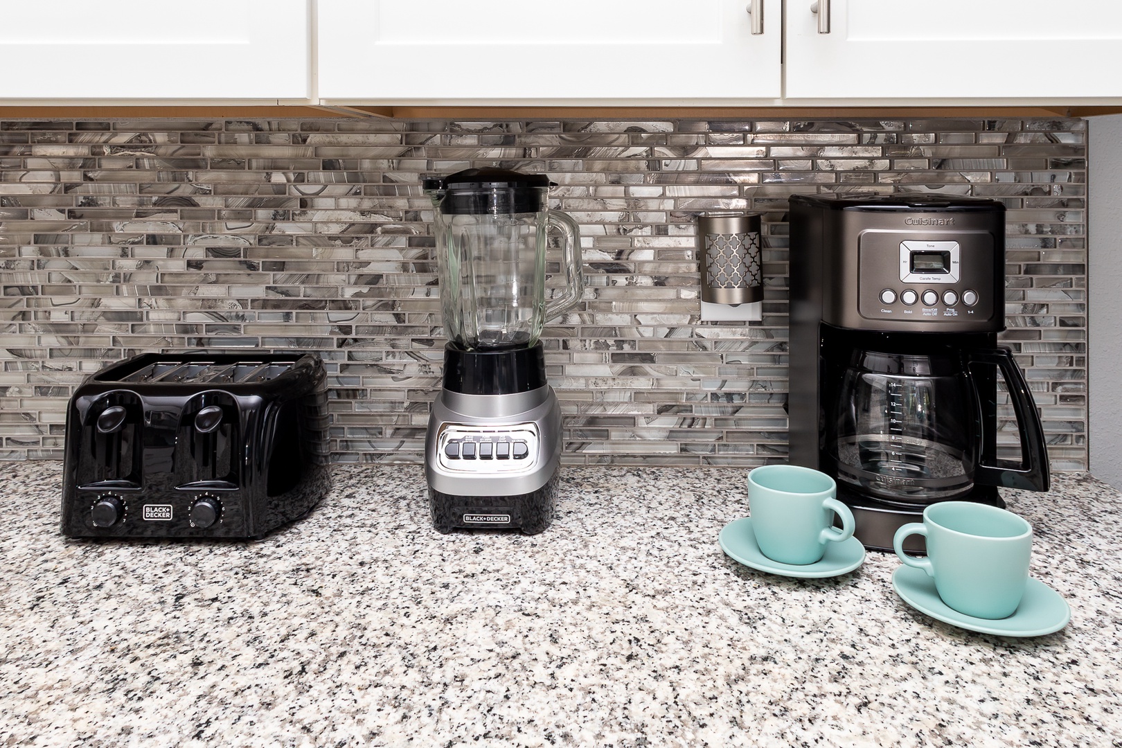 The open, airy kitchen offers ample space & all the comforts of home