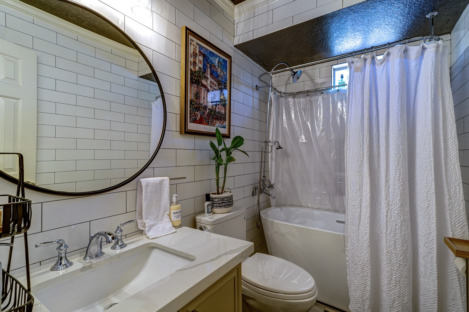 The 2nd-floor full bath includes a single vanity & shower/soaking tub combo