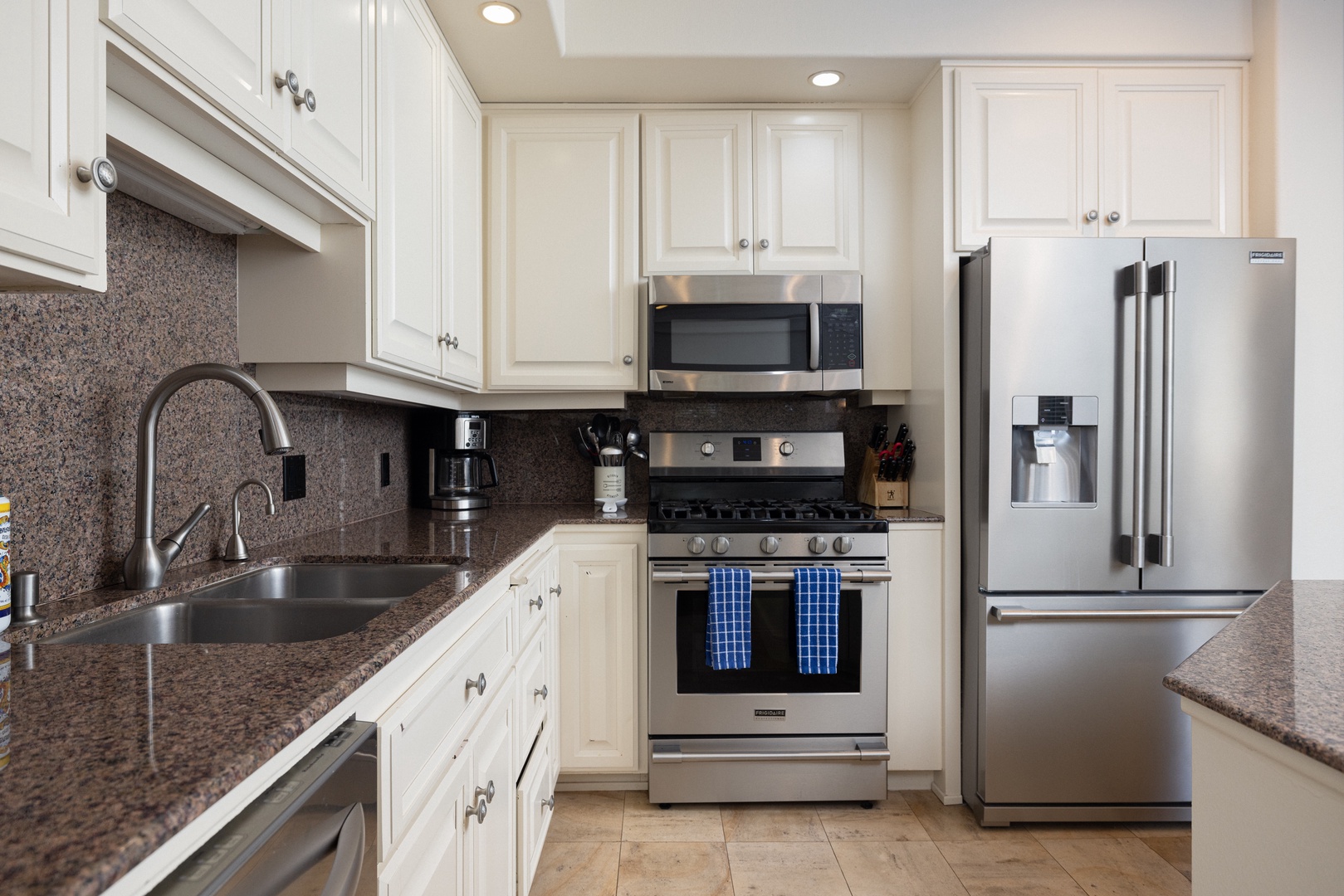 The open, airy kitchen offers ample space & all the comforts of home