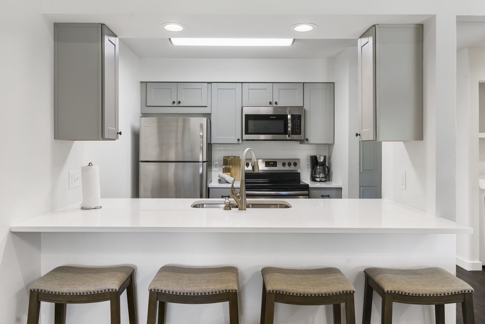 Sip morning coffee or grab a bite at the kitchen counter, offering seating for 4