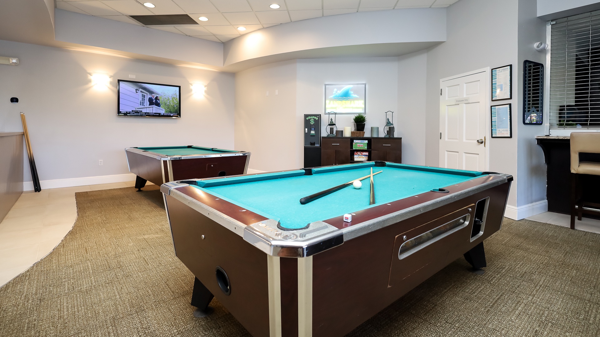 The clubhouse offers pool tables & arcade games for competitive outings