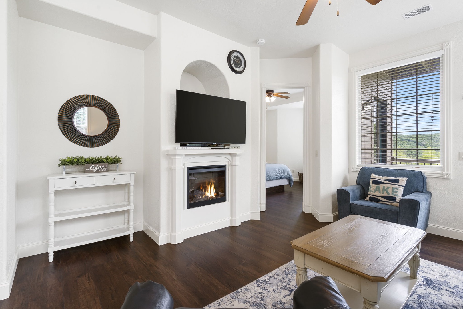 Curl up by the fireplace for a movie or to enjoy the views from the living room