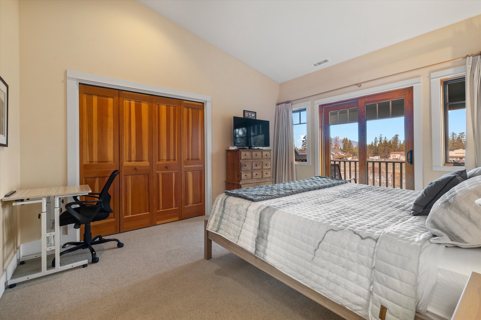 The spacious king suite boasts a private ensuite, TV, & desk workspace