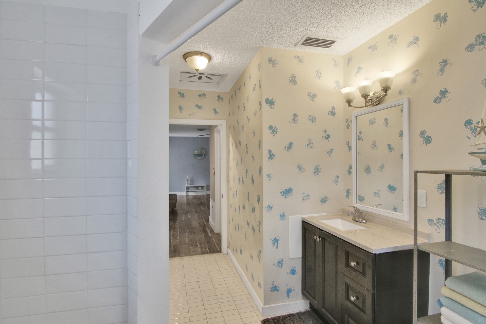 The final full bathroom offers a large vanity & walk-in shower