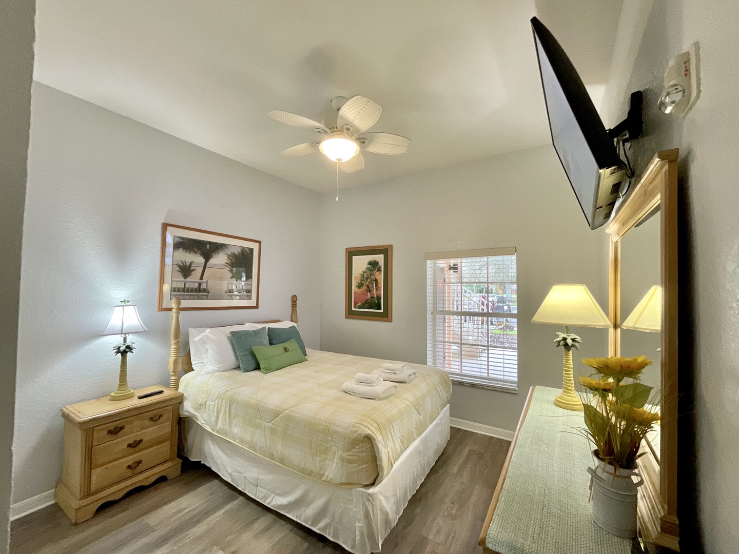 This serene bedroom offers a queen-sized bed & Smart TV